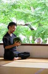 Japanese man loving a watermelon  in Japanese house
