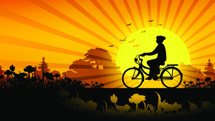 silhouette of a cyclist on the sunset