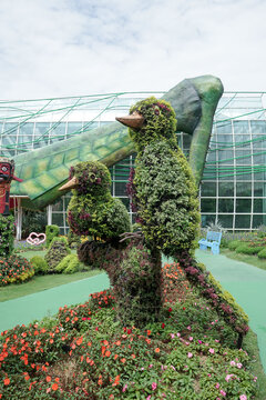 Green sculptures topiary garden created from artificial grass - gardens topiary. Creative idea for landscape design. 