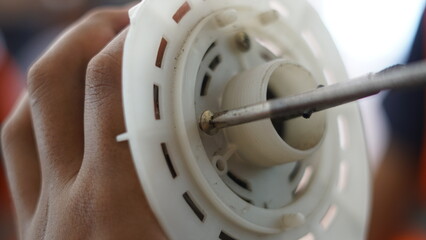 screwdriver, Electrical appliance repair,
Technician is using a screwdriver to fix electrical appliances, so that it can be used normally.