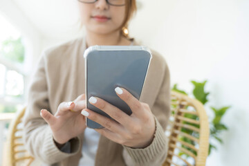 Close up of woman using mobile phone.