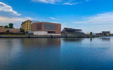 Beutiful buildings reflection on Ravenna's darsena on a morning sunny day . a dock is an enclosed area of water used for loading, unloading, building or repairing ships. Emilia-Romagna tourism