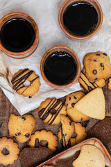 Homemade milk and chocolate cookies for a delicious snack

