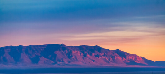 Fiery sunset illuminating the rocky mountains in New Mexico