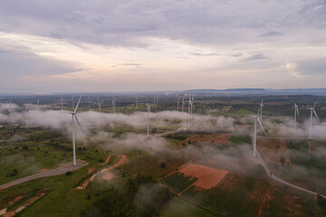 Aerial view of wind turbine sunset. Sustainable development, environment friendly, renewable energy concept.