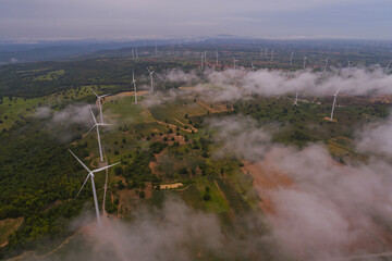 Fototapeta premium Aerial view of wind turbine sunset. Sustainable development, environment friendly, renewable energy concept.