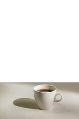 hot coffee on a table with cream being poured into it showing the texture