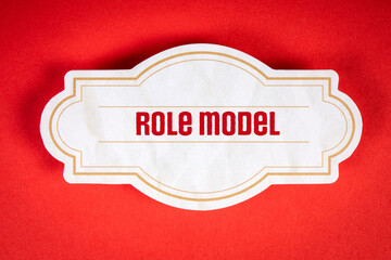 Role Model. Text on a decorative label sheet. Red background