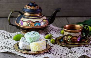 Colorful Turkish tea set with sweets on the table