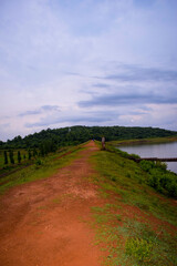 Fototapeta na wymiar path to the village near a lake