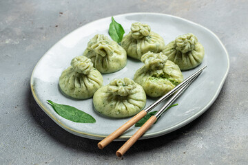 Khinkali with cheese and spinach dumplings. cooking khinkali. National Georgian cuisine. Food recipe background. Close up