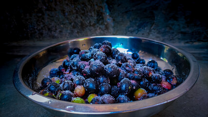 a bowl of carissa carandas fruits.