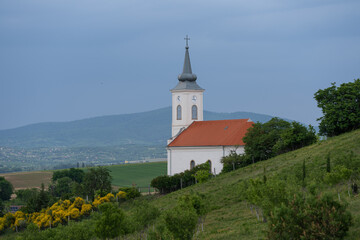 Stormy landscape with small chapel