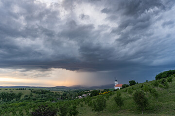 Fototapeta na wymiar Stormy landscape with small chapel