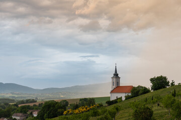 Stormy landscape with small chapel