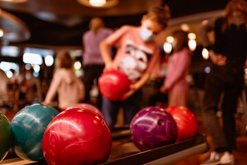 a boy playing bowling