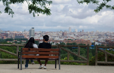 Young couple looking at panorama of city skyline