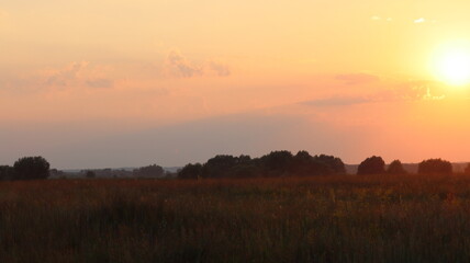 Fototapeta na wymiar Sunset over water meadows between the Staritsa River and the village of Agro-Pustyn