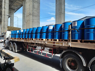 Blue tanks containing chemicals, ammonia, are arranged on trucks to deliver  It is flammable,...