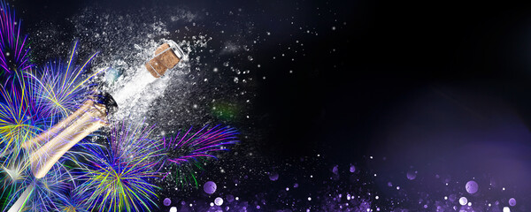 Fireworks with an exploding bottle of champagne on  black background. Ideal for New Year,...