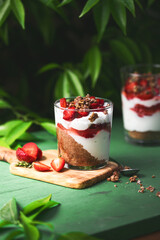 American independence holiday food, july 4 breakfast recipe idea. Summer diet healthy breakfast layered parfait dessert in a glass of yogurt, oatmeal, blueberries, strawberry berries