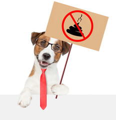 Smart Jack russell terrier puppy holds sign 