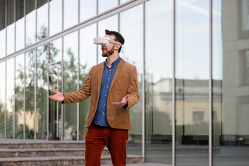 Portrait of man in virtual reality glasses. Guy in VR headset watching 3d movie, playing in VR games, enjoys virtual tour of tourist attractions. Businessman works in cyberspace.