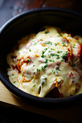 Cheese vegetable in a cast iron pan