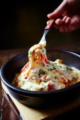 Cheese vegetable in a cast iron pan