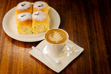 sweet bread stuffed with chocolate and a cup of coffee