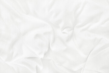 Close up top view of white bedding sheet and wrinkle messy blanket in bedroom after wake up in the...
