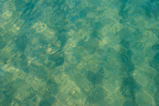 Blue water texture background. Surface of sea or ocean