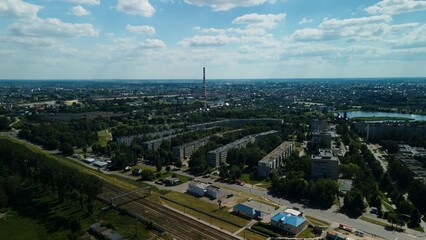 Tranquil suburbs in a big city. Multi-storey buildings and a large green area. Panoramic photo. Aerial photography.
