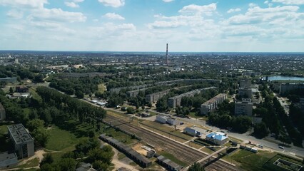 Tranquil suburbs in a big city. Multi-storey buildings and a large green area. Panoramic photo. Aerial photography.