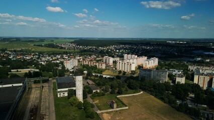 Obraz premium Tranquil suburbs in a big city. Multi-storey buildings and a large green area. Panoramic photo. Aerial photography.
