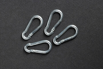 4mm climbing carabiner isolated against a dark background