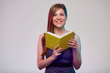 Teacher or smiling  woman adult student holding open yellow book isolated portrait.