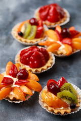 Tart stuffed cream and decorated by fruits