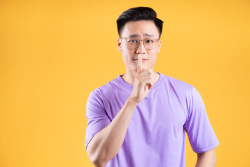 Image of young Asian man posing on background