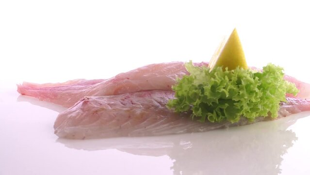 Raw Sea Bream Fish Fillet turn around isolated on white Background