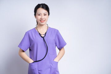 Portrait of young Asian nurse on white background