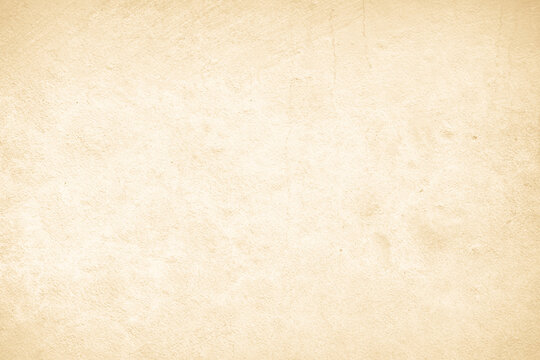 Old concrete wall texture background. Close up retro plain cream color cement material surface.