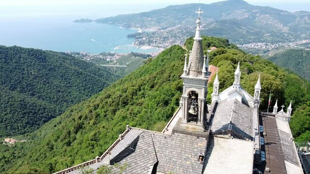 Italy, Rapallo, Liguria, Drone aerial view of the Catholic Church sanctuary of Montallegro stands on the top of the  mountain overlooking the sea of the bay of Portofino near Genova and Cinque Terre