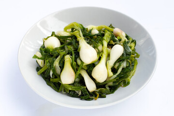 Pickled spring onion in white bowl