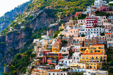 Fototapeta na wymiar Panorama of Positano with colorful houses resting climbing up the hill, Amalfi coast, Campania, Italy
