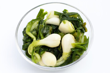 Pickled spring onion in glass bowl