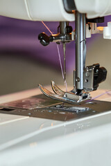 Sewing machine foot. Close-up, selective focus