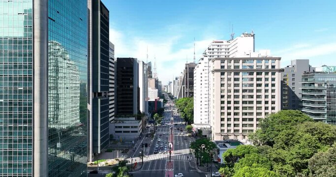 Aerial flying through buildings on Paulista Avenue towards Sao Paulo Museum of Art