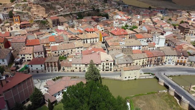 Beautiful city San Esteban de Gormaz situated in province of Soria - Spain. Aerial view of the city and the river Duerdo. The town is located in the Wool Route and the Way of the Cid. Drone forward