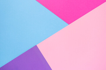 Multicolor abstract flat lay composition. Pink, purple, violet and light blue paper background. Geometric figures, shapes, lines. Copy space, top view. Back to school concept.